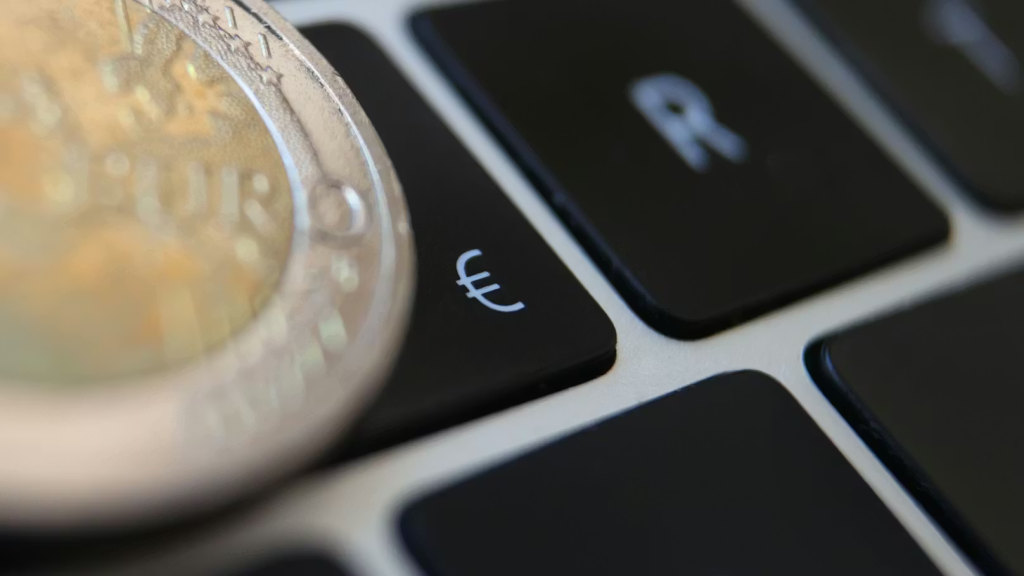 Image of a coin on top of a laptop