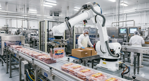 An image of a robot arm packing a food product in a food processing plant